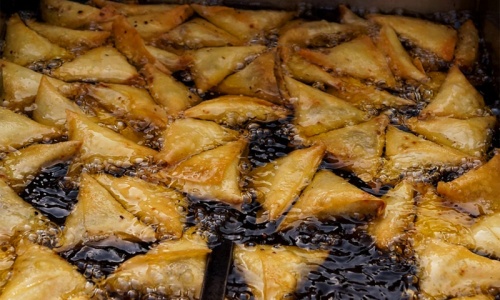  Samosas getting fried. 