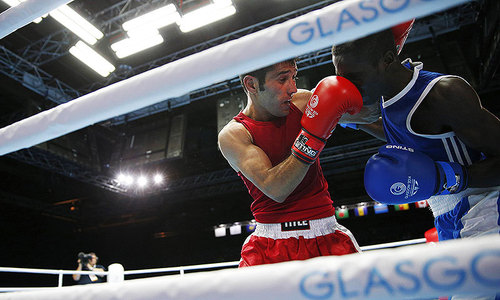Waseem survives knockdown to win semi-final bout