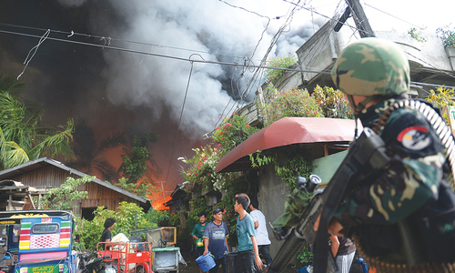 Enduring pain a year after rebel attack on Philippine city