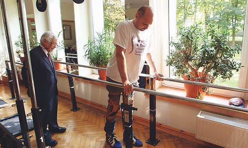 Paralysed man walks again after revolutionary treatment