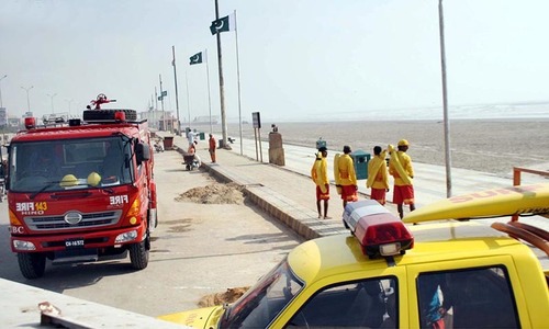 A fire brigade, ambulance and divers are seen present at Clifton Sea View to prepare for the effects of Cyclone Nilofar. — Photo by Online