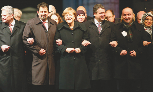 Merkel vows to fight bigotry after anti-Islam march