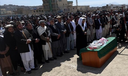 Afghan women carry body of lynched woman to burial