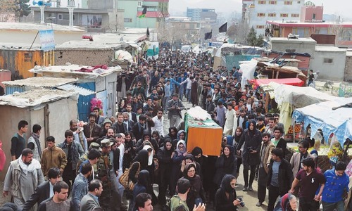 Women carry body of lynched Afghan woman to graveyard