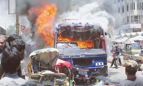 Bus torched after two die in Liaquatabad accident