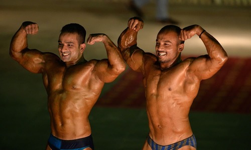 Bodybuilders flex muscles for Mr Islamabad title