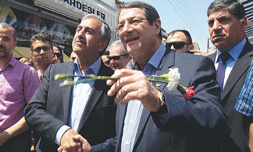 Rival leaders take stroll through divided capital of Cyprus Rival leaders take stroll through divided capital of Cyprus