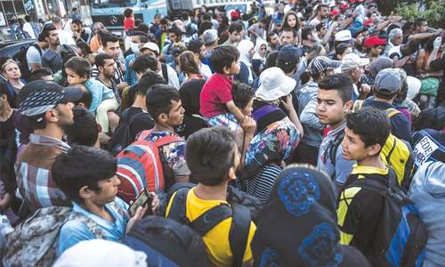 Merkel vows no tolerance for migrant hate; 40 bodies found off Libya Merkel vows no tolerance for migrant hate; 40 bodies found off Libya