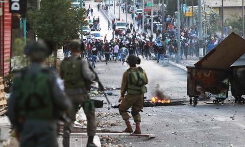 Israeli troops kill six Palestinians, unrest spreads to Gaza