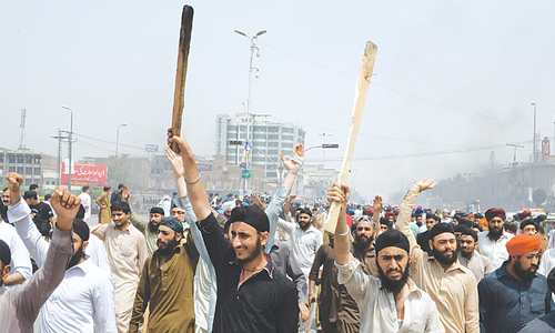 Sikhs protest desecration of holy book in India