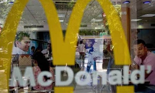 McDonald's owner fires worker seen throwing water on homeless man