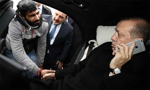 Turkey's Erdogan talks man on bridge out of suicide