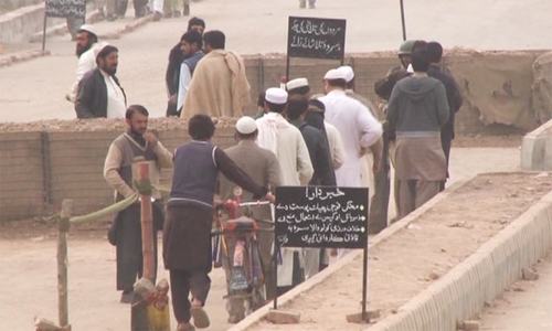 Locals entering the Bara Bazaar proceed through a security checkpoint. ─ Photo by author