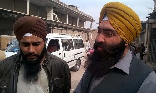 Satbeer Singh (right) lost goods worth Rs. 100,000 when Bara Bazaar closed in 2009. ─ Photo by author