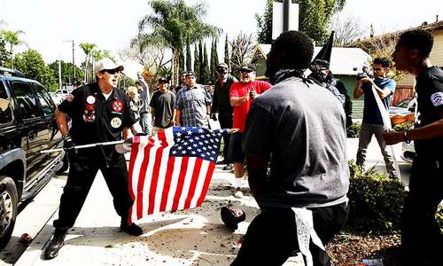 Four stabbed in melee at site of Ku Klux Klan rally