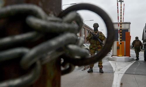 Belgium hunts IS bombings suspects as country mourns