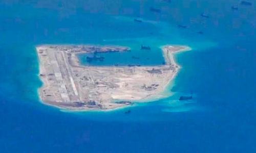 China lands first military plane on disputed reef China lands first military plane on disputed reef