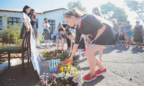 Two years on, Ukraine villagers mourn at MH17 crash site