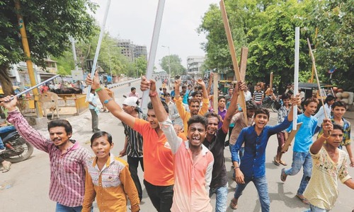 Protests erupt in Modi&rsquo;s state over attack on low-caste men
