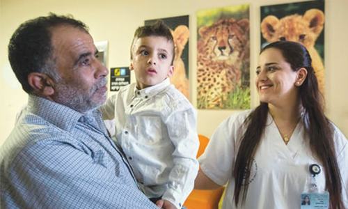 Palestinian arson survivor boy leaves hospital after one year