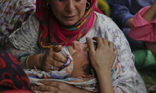 An unidentified family member of a killed civilian cries during a joint funeral, August 2016. ─ AP