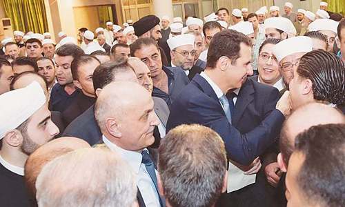 Syria's Assad makes rare public appearance for Eid prayers in town surrendered by rebels