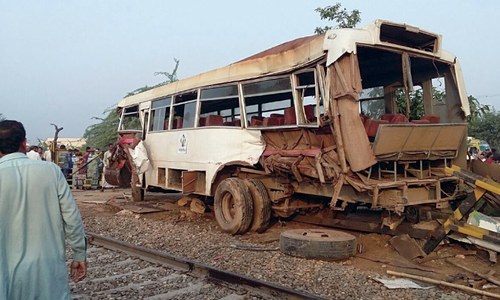 Four killed as freight train hits bus