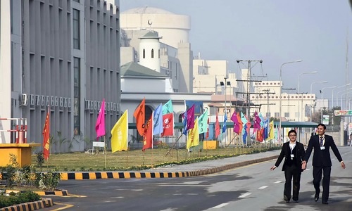 Officials walk before the inaugural ceremony of The Chashma-III reactor. —AFP