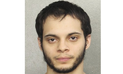 US veteran arrested in airport shooting; family says 'lost his mind' after Iraq tour