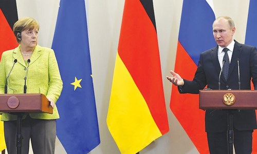 Putin, Merkel struggle to move past differences in tense meeting