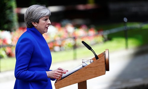 Defiant May vows to form new government despite UK election blow