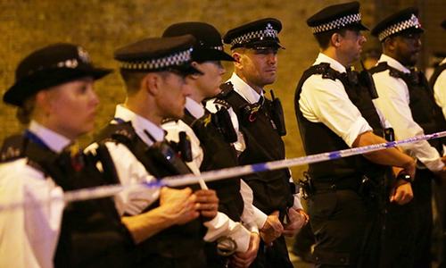 Police cordon off a street in the Finsbury Park area of north London after a vehichle hit pedestrians.─AFP