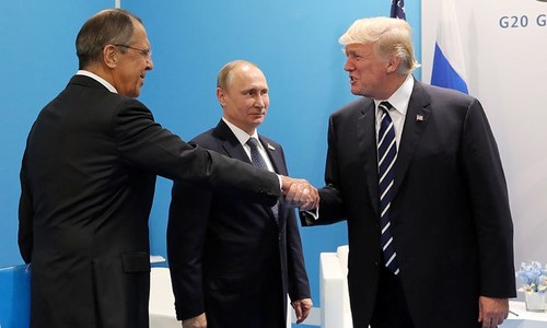 Trump confronts Putin on election hacking in first meeting
