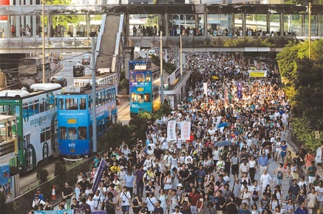 Tens of thousands protest in HK over jailing of democracy activists Tens of thousands protest in HK over jailing of democracy activists
