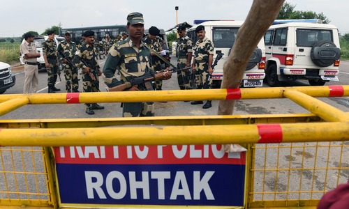 Indian court sentences controversial guru to 20 years in prison on rape charges
