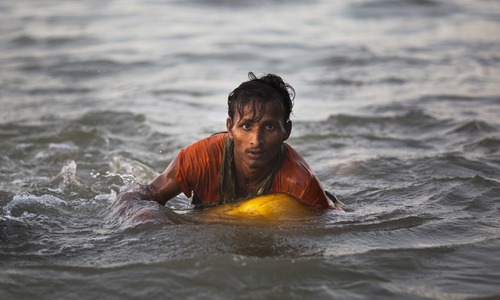 'I was so scared of dying': Desperate Rohingyas swim from Myanmar to Bangladesh to flee violence