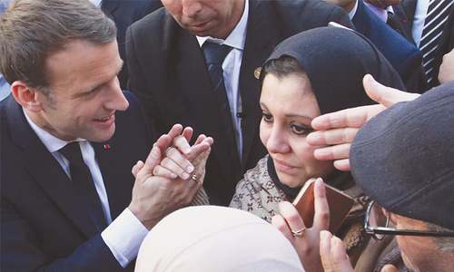 Macron seeks warmer ties with former colony Algeria
