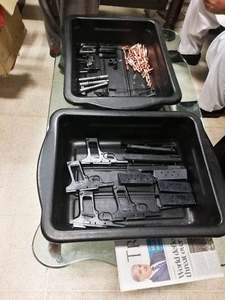 Four pistols, eight magazines and some bullets were found from the suspect's possession. —Photo courtesy ASF