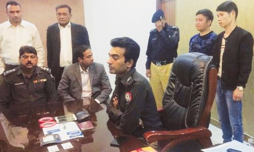 Two Chinese men held with skimming device for &lsquo;stealing&rsquo; data from ATM