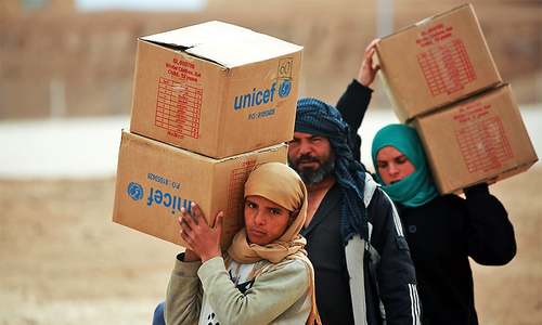 Bowing to pressure to halt carnage, Russia calls daily truce in battered Syrian enclave