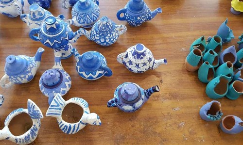 Students' pottery on display.