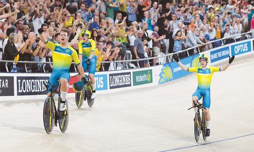 Record-breaking Aussies dominate with cycling, swimming gold medals