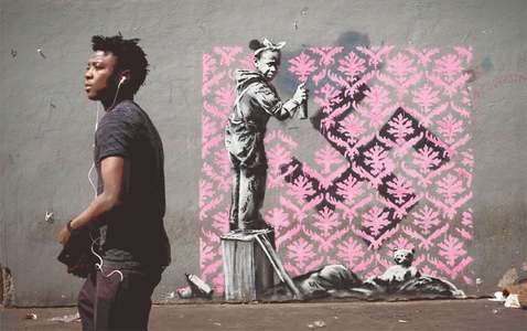 Graffiti artist Banksy needles France with migrant mural blitz