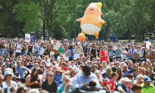 Thousands protest against Trump in Edinburgh; UK police seek paraglider