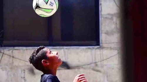 FC Barcelona coaches train Lyari's little football star Adeel Hanif