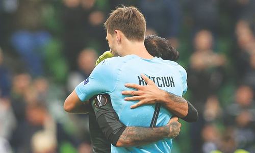 KRASNODAR: FC Krasnodar players celebrate victory over Sevilla in their Group ‘J’ match.—AFP