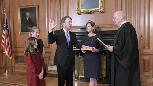 Kavanaugh sworn in as US Supreme Court justice as protesters chant outside