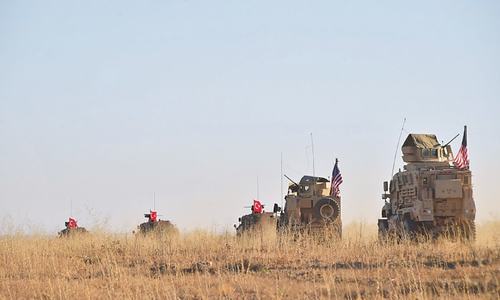 Shelling kills eight in de-escalation zone around Syrian city