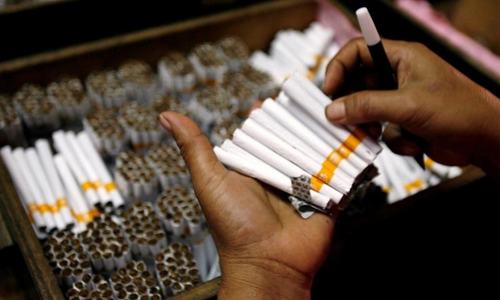 Asad orders probe into Rs60bn tobacco industry scam