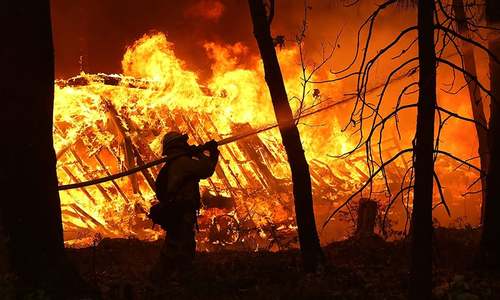 9 dead in California wildfires, tens of thousands forced to flee